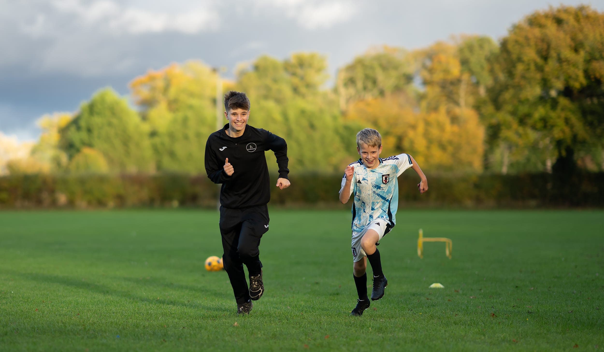 One 2 one football coaching where the coach is racing the boy over at Mulbarton, Norwich.